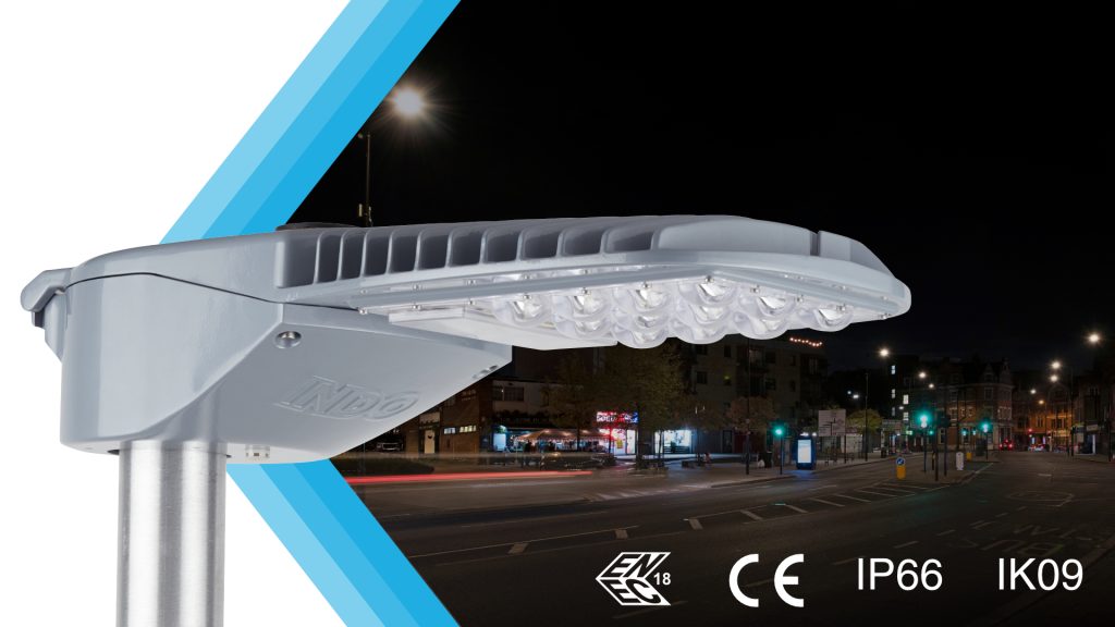 INDO AIR2 LED street light over a night street scene, showing ENEC, CE, IP66 and IK09 certification marks