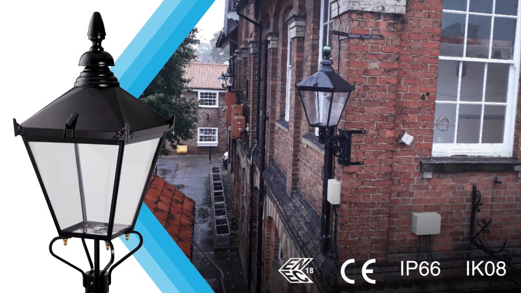 INDO Chancery lantern on a brick building at night, with CE, IP66 and IK08 certification icons