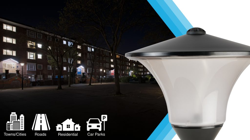 INDO Radius luminaire on a lit street at night, for towns, roads, residential areas and car parks