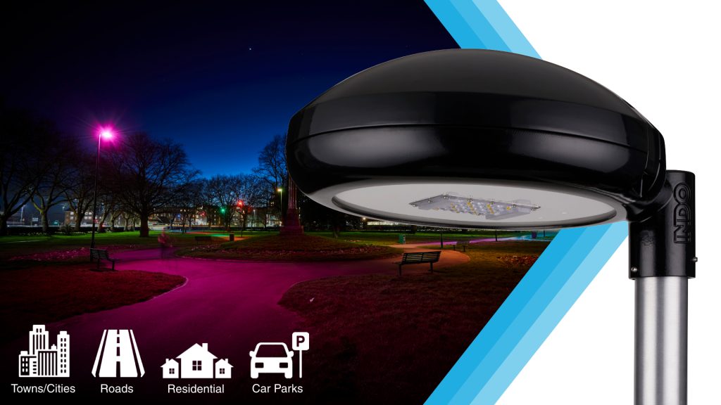 INDO RD12 luminaire close-up with a pink-lit park path at dusk, for towns, roads, residential areas and car parks